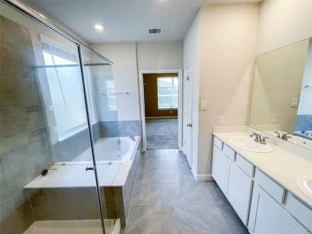 bathroom featuring separate shower and tub, tile patterned flooring, and vanity