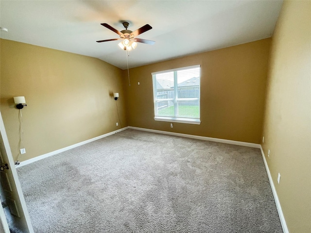 spare room featuring carpet floors and ceiling fan