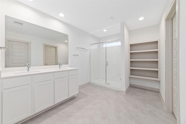 bathroom with vanity and walk in shower