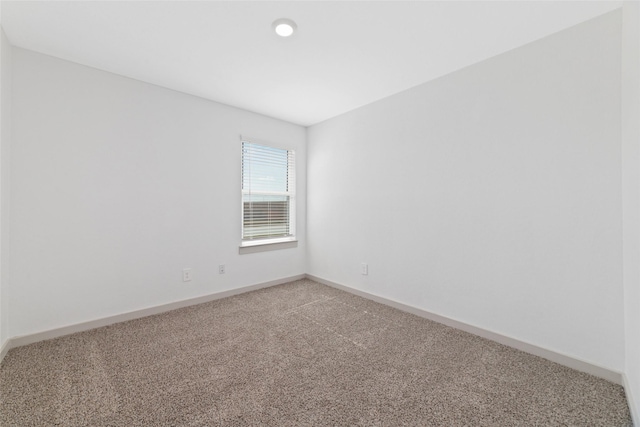 unfurnished room with carpet floors