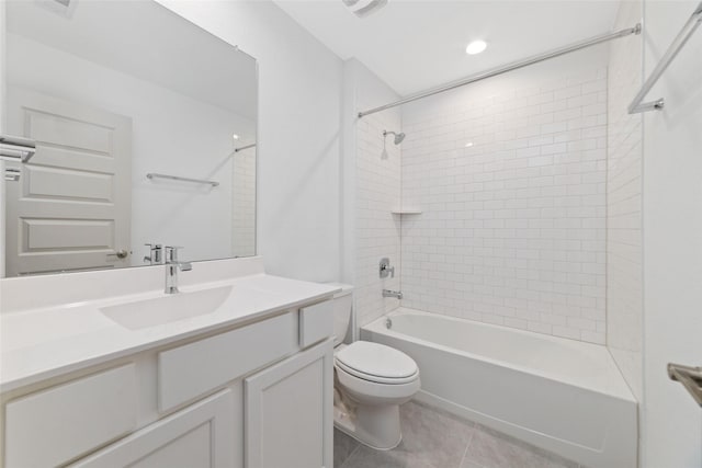 full bathroom with tile patterned flooring, vanity, toilet, and tiled shower / bath