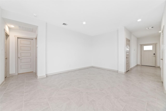 spare room featuring light tile patterned floors