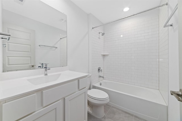 full bathroom with tile patterned floors, toilet, vanity, and tiled shower / bath