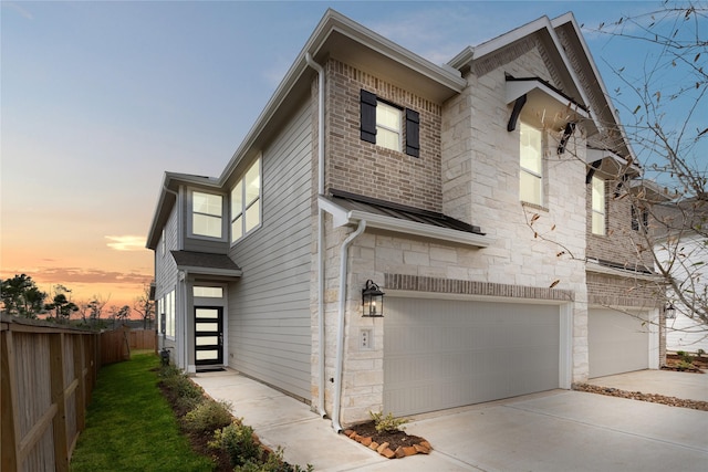 property exterior at dusk with a garage