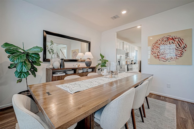 dining area with dark wood-type flooring