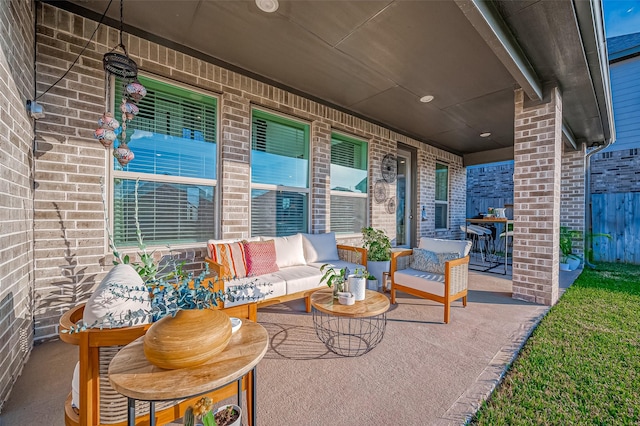 view of patio / terrace with covered porch and an outdoor living space