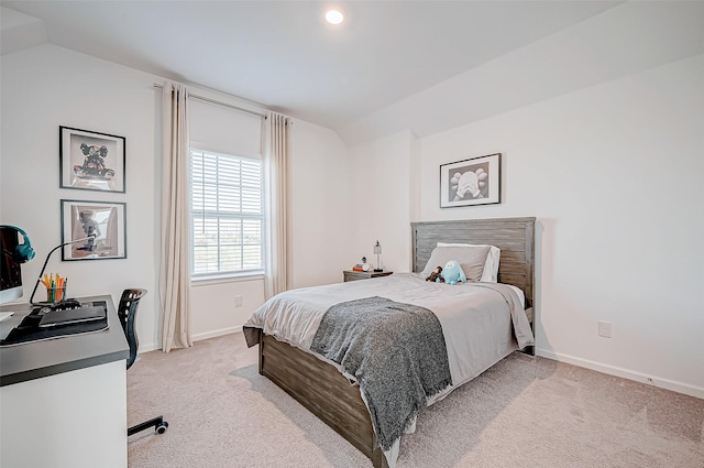 carpeted bedroom featuring lofted ceiling