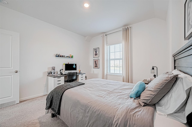 carpeted bedroom with vaulted ceiling