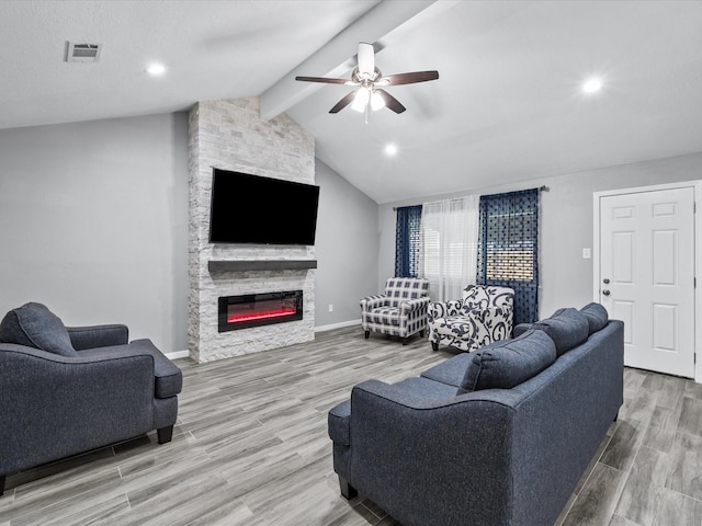 living room with lofted ceiling with beams, a fireplace, ceiling fan, and wood-type flooring