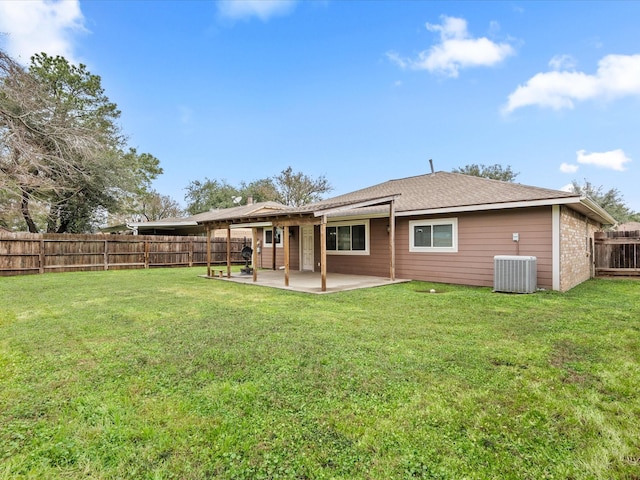 back of property featuring a yard, a patio, and central AC