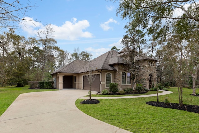 view of front facade with a front yard and a garage