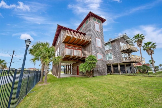 back of property featuring a lawn and a balcony