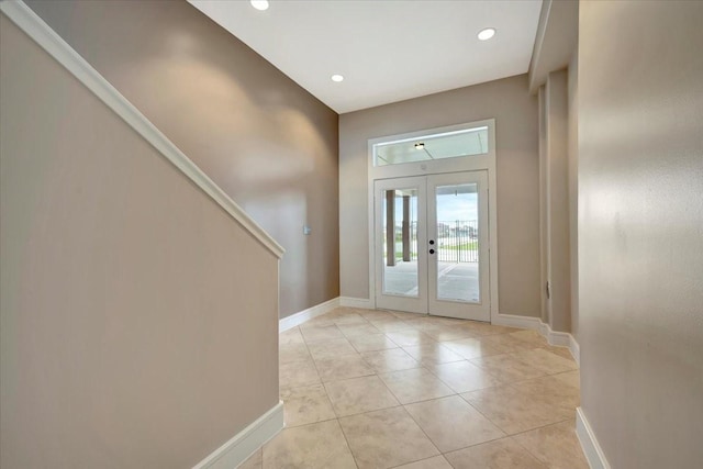 tiled foyer entrance with french doors