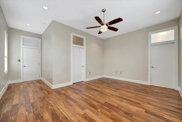 unfurnished bedroom with hardwood / wood-style floors and ceiling fan