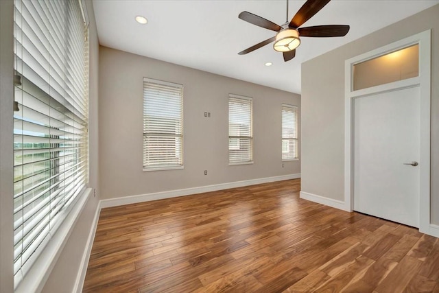 unfurnished bedroom with ceiling fan and wood-type flooring