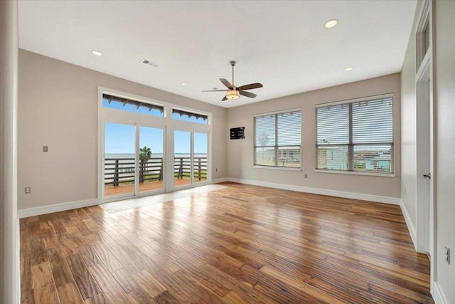 spare room featuring ceiling fan and wood-type flooring