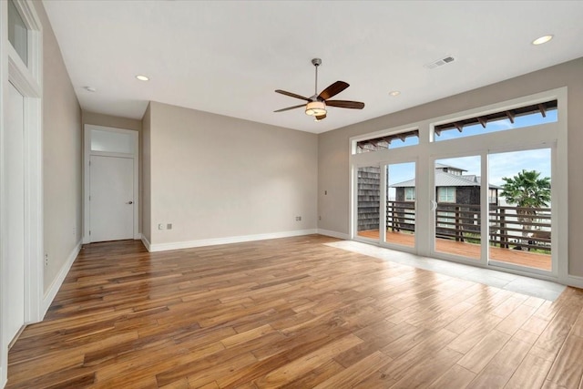 spare room featuring ceiling fan and hardwood / wood-style flooring