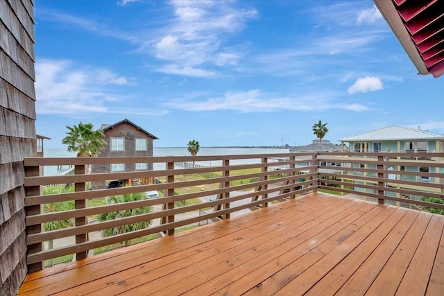 wooden deck featuring a water view