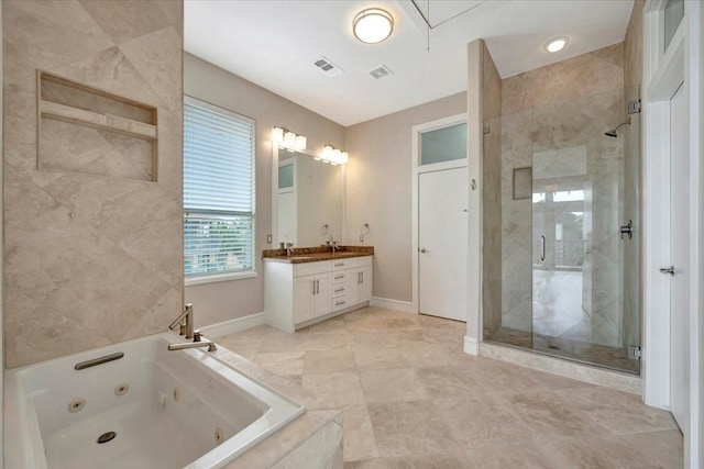 bathroom with vanity and independent shower and bath