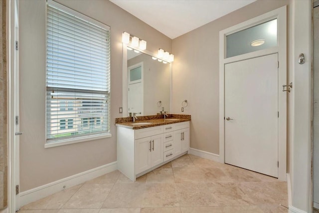 bathroom featuring tile patterned floors and vanity