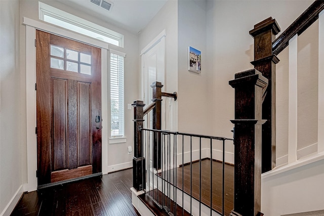 entryway with dark wood-type flooring