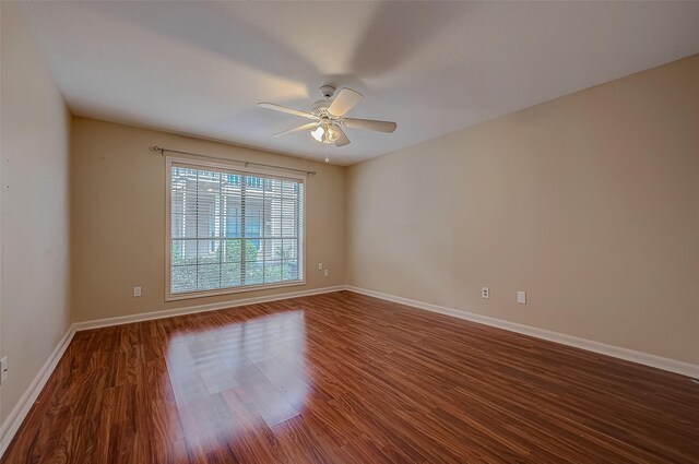 empty room featuring ceiling fan and wood-type flooring