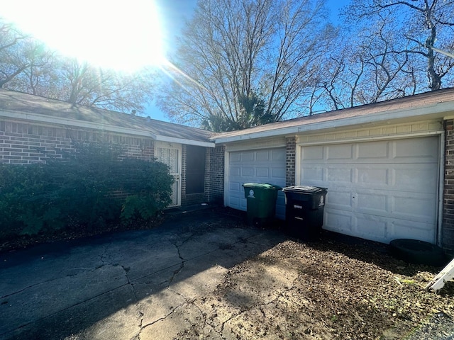 view of home's exterior with a garage and an outdoor structure