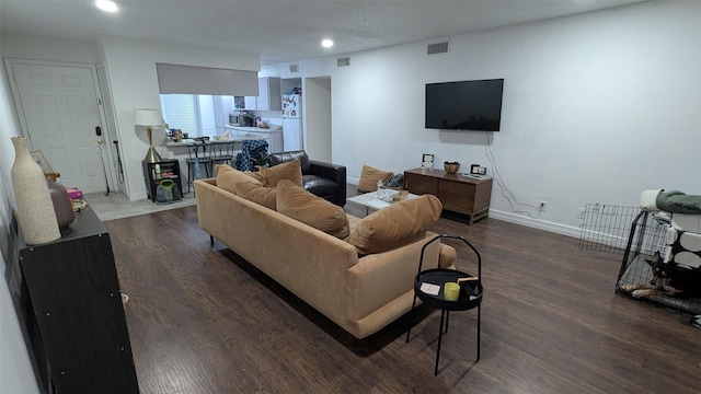 living room featuring dark hardwood / wood-style floors