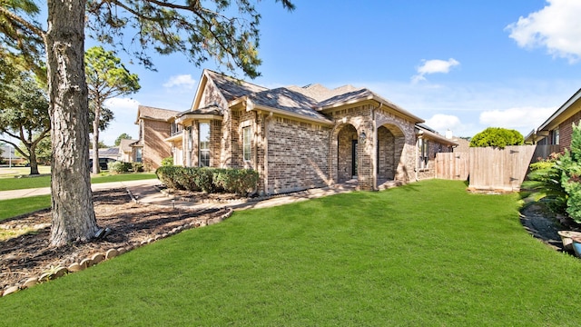 view of front of home with a front lawn