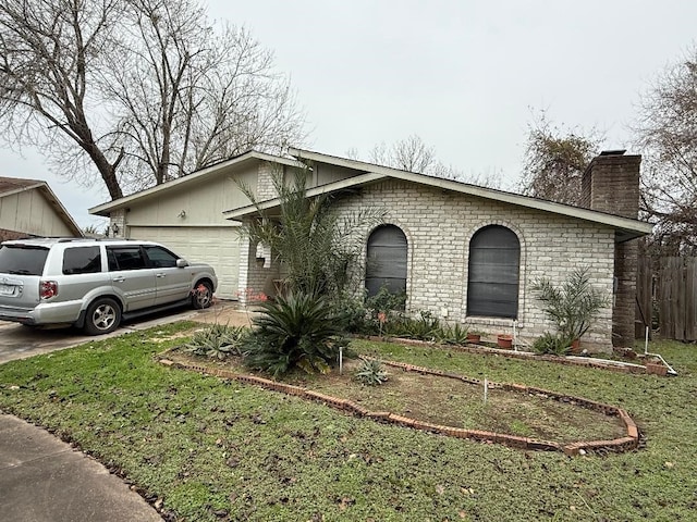 view of front facade featuring driveway, a chimney, an attached garage, fence, and a front lawn