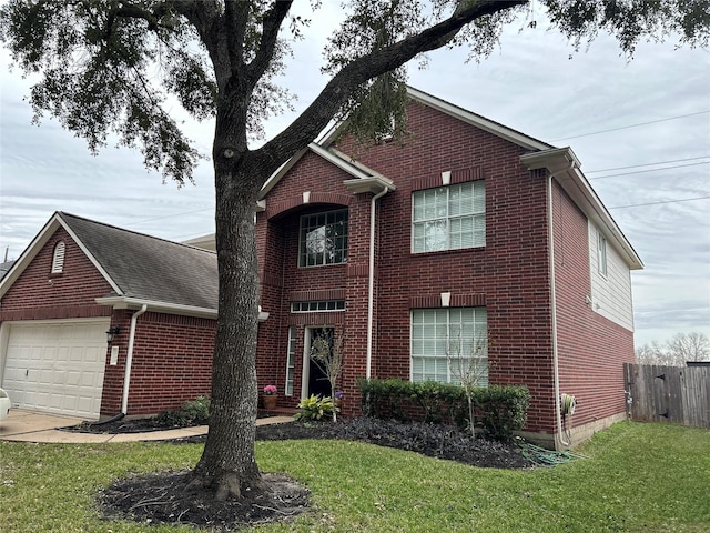 front facade with a front yard and a garage