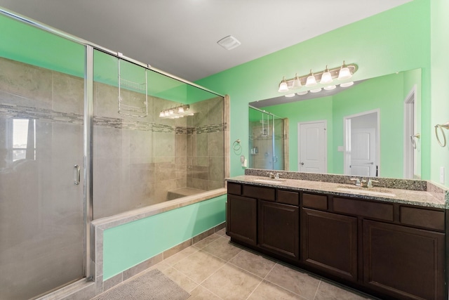 bathroom with tile patterned flooring and vanity