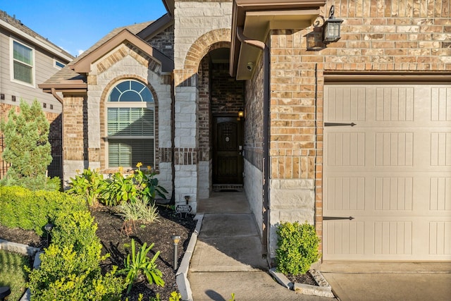 view of exterior entry featuring a garage