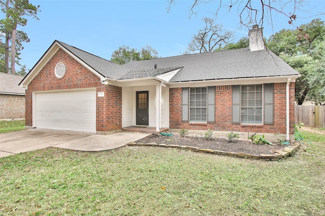 ranch-style home featuring a garage and a front yard