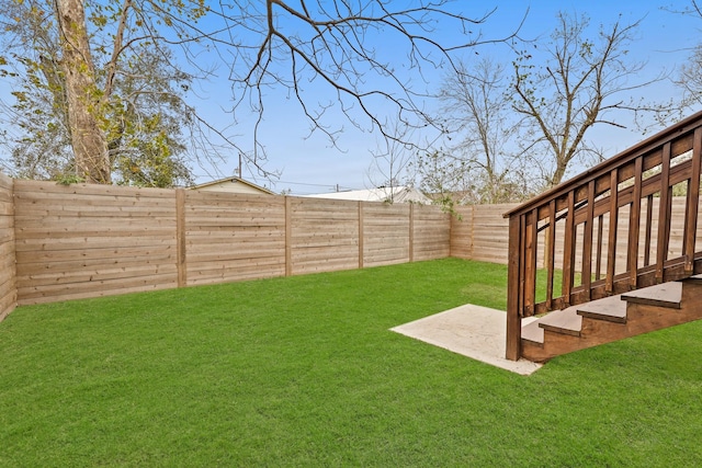 view of yard featuring a fenced backyard