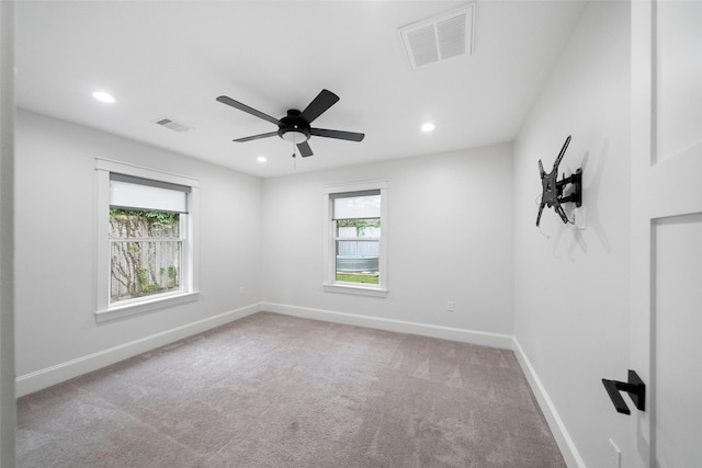 unfurnished room featuring carpet and ceiling fan