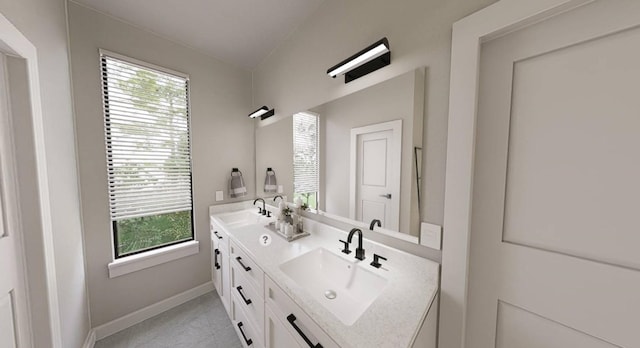 bathroom featuring tile patterned flooring and vanity