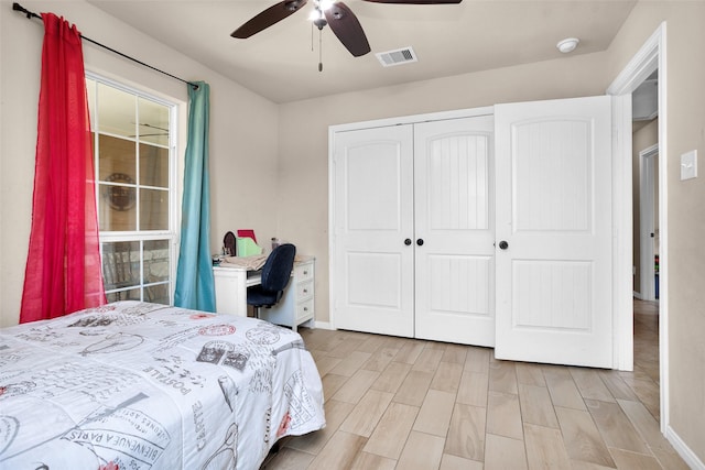 bedroom featuring ceiling fan, a closet, and light hardwood / wood-style floors