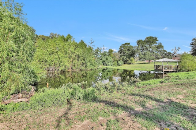 view of yard with a gazebo and a water view