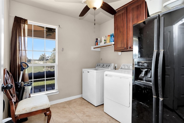 laundry room featuring ceiling fan, cabinets, independent washer and dryer, and light tile patterned floors