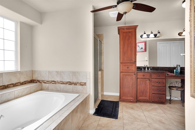 bathroom featuring tile patterned floors, ceiling fan, shower with separate bathtub, and vanity