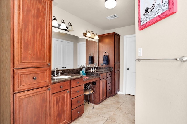 bathroom with vanity and tile patterned floors