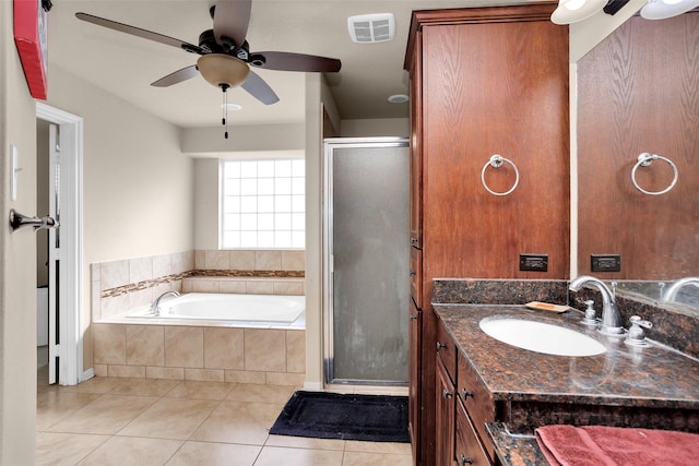 bathroom with tile patterned flooring, vanity, ceiling fan, and independent shower and bath