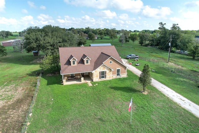 birds eye view of property with a rural view