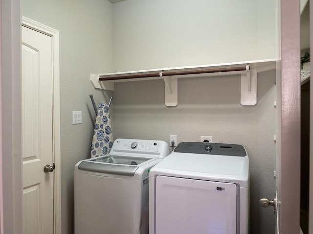 laundry room with separate washer and dryer