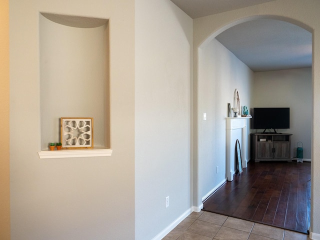 corridor with light tile patterned floors