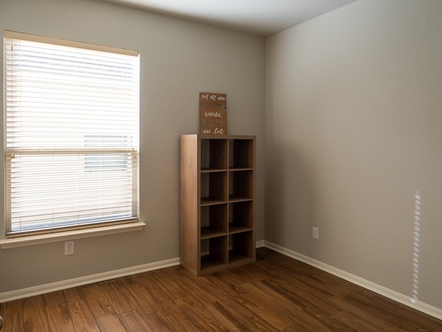 unfurnished room featuring dark hardwood / wood-style floors