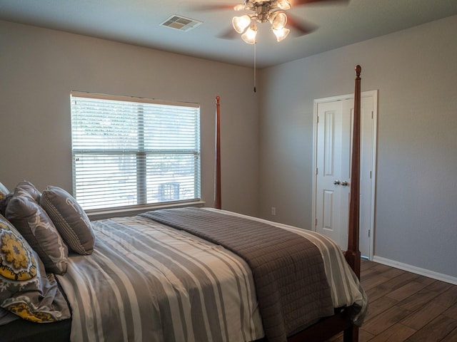 bedroom featuring ceiling fan and dark hardwood / wood-style flooring