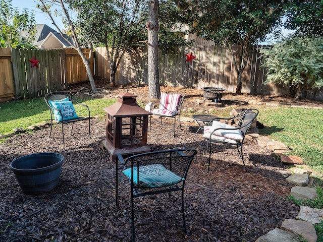 view of yard with a fire pit