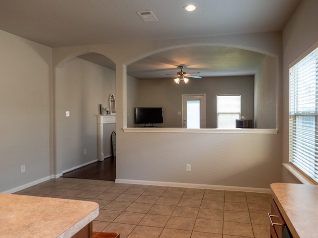 interior space featuring ceiling fan